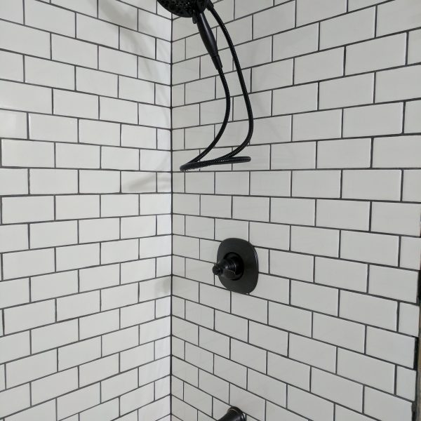 Faucet, handle, and shower head.